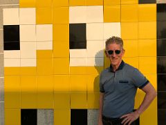 10B Jerome Ryan poses with Invader - Harbour City Pac-Man street art Hong Kong